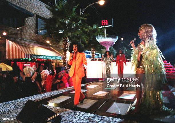 1/7/96. WEST HOLLYWOOD, CALIFORNIA. DIANA ROSS LEFT AND RU PAUL THE MALE TRANSVESTITE ENTERTAINER MAKE A MUSIC VIDEO ON SANTA MONICA BOULEVARD