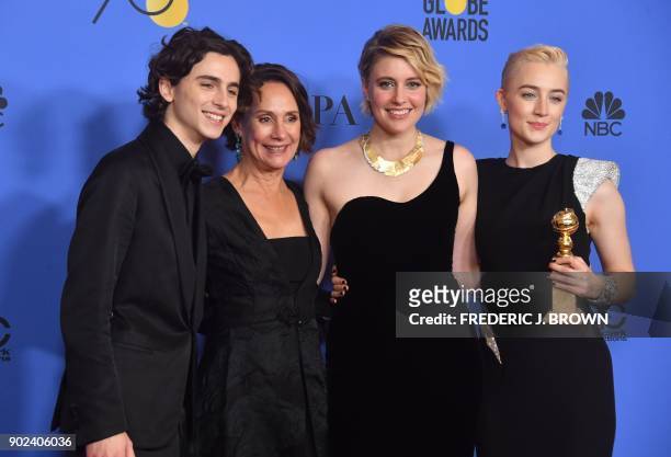 Timothee Chalamet, Laurie Metcalf, Greta Gerwig and Saoirse Ronan poses with the award for Best Motion Picture Musical or Comedy in 'Lady Bird'...