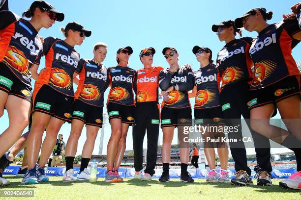 Lisa Keightley, coach of the Scorchers and Elyse Villani address the team before warming up during the Women's Big Bash League match between the...
