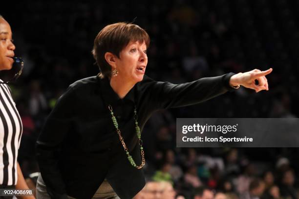 Notre Dame Fighting Irish head coach Muffet McGraw directs her defense during the women's college basketball game between the Notre Dame Fighting...