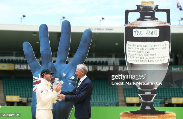 Steve Smith of Australia is presented with the Ashes trophy by Bill Lawry after winning the Ashes during day five of the Fifth Test match in the...
