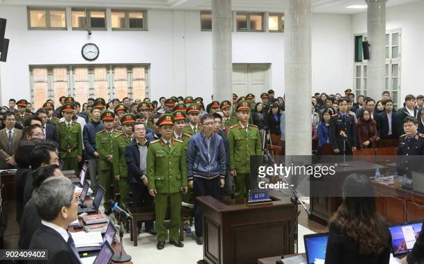 Trinh Xuan Thanh , a former oil executive and others defendants, stand trial at the courtroom of Hanoi People's Court on January 8, 2018. The...