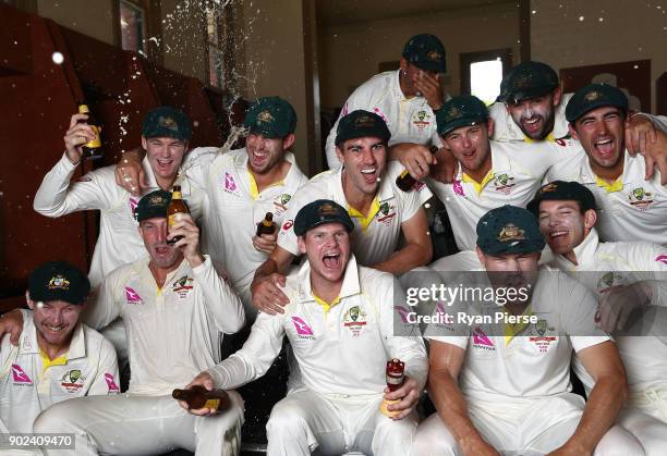 Australia celebrate with the Ashes Urn in the changreooms during day five of the Fifth Test match in the 2017/18 Ashes Series between Australia and...