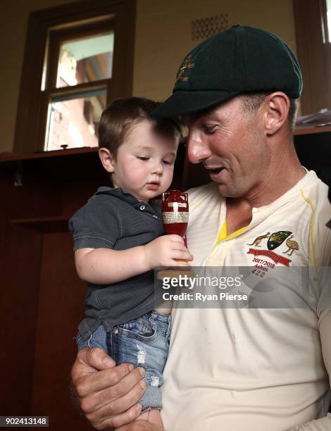 Shaun Marsh of Australia and his son Austin celebrate with the Ashes Urn during day five of the Fifth Test match in the 2017/18 Ashes Series between...