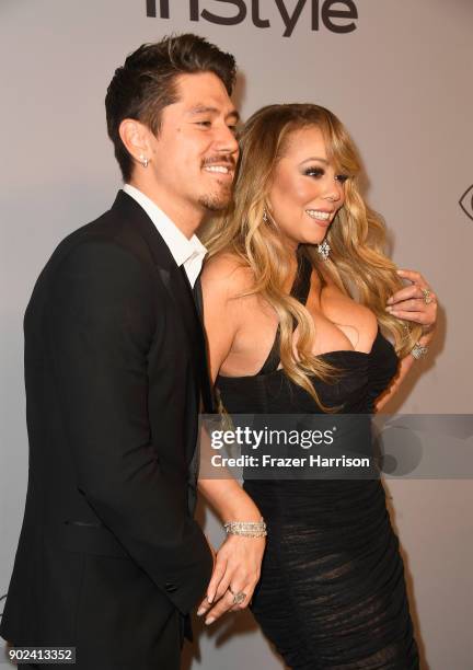Bryan Tanaka and recording artist Mariah Carey attend the 19th Annual Post-Golden Globes Party hosted by Warner Bros. Pictures and InStyle at The...