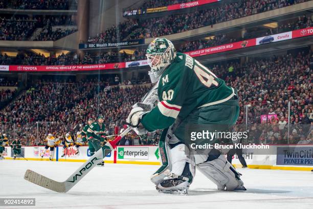 Devan Dubnyk of the Minnesota Wild handles the puck against the Nashville Predators during the game at the Xcel Energy Center on December 29, 2017 in...