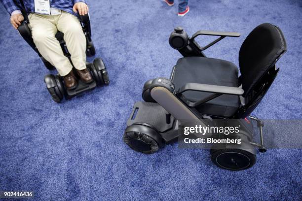 Whill Inc. Model Ci ultra-portable intelligent personal electric vehicles are demonstrated during the CES Unveiled event at the 2018 Consumer...