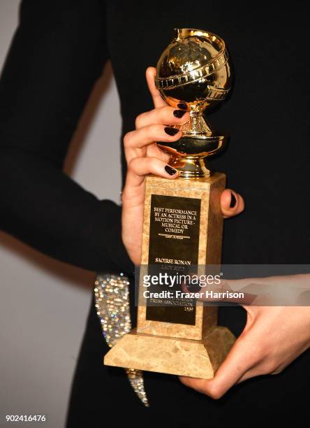 Actor Saoirse Ronan, Golden Globes trophy detail, attends 19th Annual Post-Golden Globes Party hosted by Warner Bros. Pictures and InStyle at The...