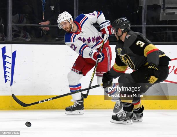 Kevin Shattenkirk of the New York Rangers takes a shot against Brayden McNabb of the Vegas Golden Knights in the first period of their game at...