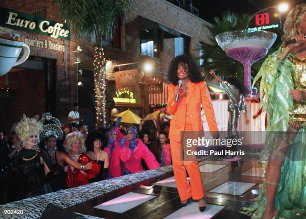 1/7/96. WEST HOLLYWOOD, CALIFORNIA. DIANA ROSS LEFT AND RU PAUL THE MALE TRANSVESTITE ENTERTAINER MAKE A MUSIC VIDEO ON SANTA MONICA BOULEVARD