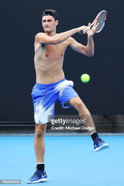 Bernard Tomic of Australia hits a forehand during a practice session ahead of the 2018 Australian Open at Melbourne Park on January 8, 2018 in...