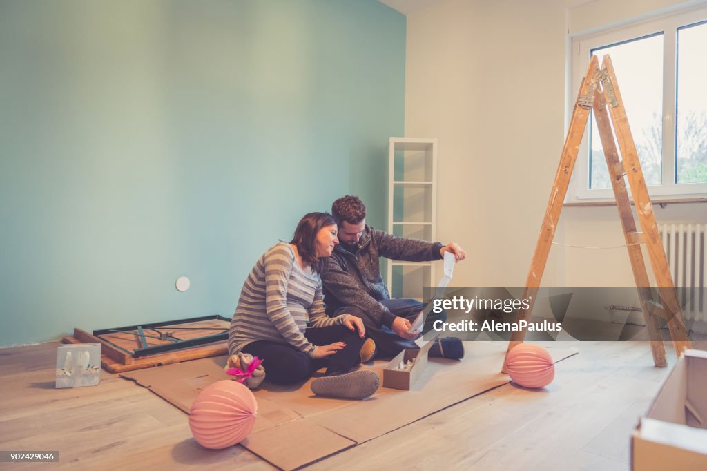 Pregnant couple in a new home