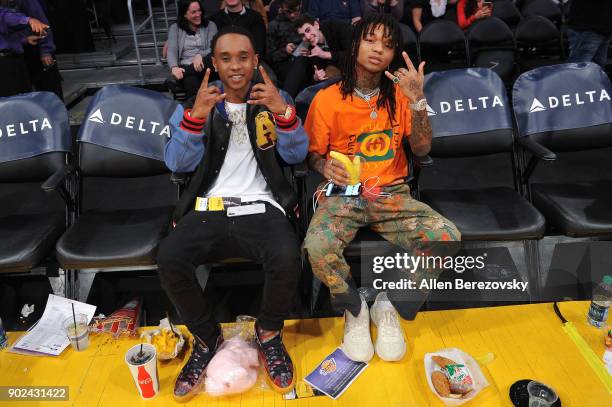 Recording artists Slim Jxmmi and Swae Lee of the hip-hop group Rae Sremmurd attend a basketball game between the Los Angeles Lakers and the Atlanta...