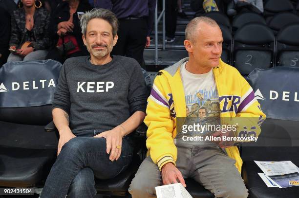 Recording artists Adam Horovitz aka Ad-Rock of the Beastie Boys and Michael Peter Balzary aka Flea of the Red Hot Chili Peppers attend a basketball...