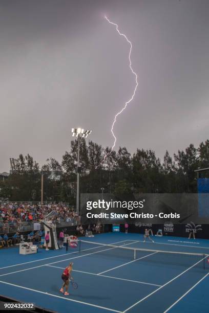 Lightning stops play in the first round match between Angelique Kerber of Germany and Lucie Safarova of the Czech Republic during day one of the 2018...