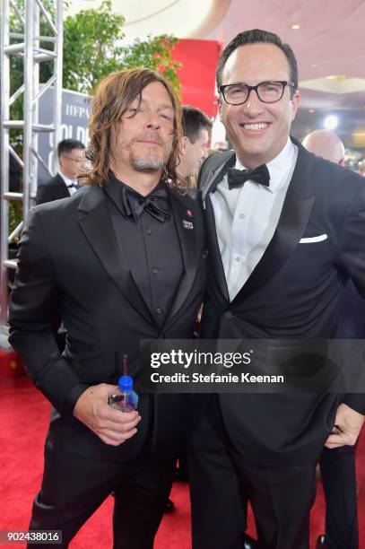 Actor Norman Reedus and AMC president and general manager, Charlie Collier attend The 75th Annual Golden Globe Awards at The Beverly Hilton Hotel on...