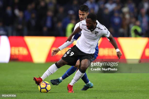 Junior Tallo of Vitoria SC vies with Porto's Mexican defender Diego Reyes during the Premier League 2017/18 match between FC Porto and Vitoria SC, at...