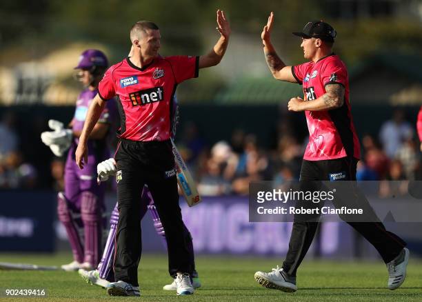 Jackson Bird of the Sydney Sixers celebreates taking the wicket of Matthew Wade of the Hurricanes during the Big Bash League match between the Hobart...