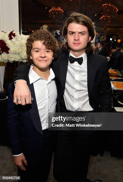 Actors Gaten Matarazzo and Joe Keery attend the 2018 InStyle and Warner Bros. 75th Annual Golden Globe Awards Post-Party at The Beverly Hilton Hotel...