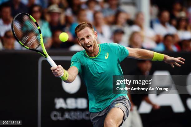 Michael Venus of New Zealand plays a forehand in his first round match against Roberto Bautista Agut of Spain during day one of the ASB Men's Classic...