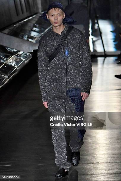 Model walks the runway at the Cottweiler show during London Fashion Week Men's Fall/Winter 2018/2019 in January 2018 at Natural History Museum on...