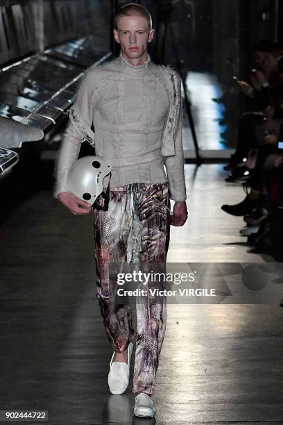 Model walks the runway at the Cottweiler show during London Fashion Week Men's Fall/Winter 2018/2019 in January 2018 at Natural History Museum on...