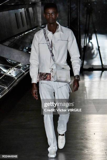 Model walks the runway at the Cottweiler show during London Fashion Week Men's Fall/Winter 2018/2019 in January 2018 at Natural History Museum on...