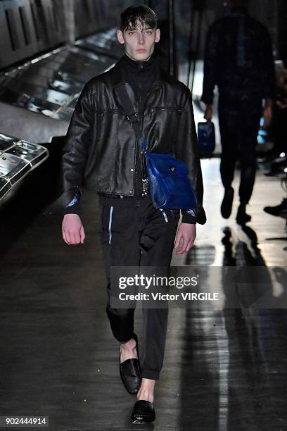 Model walks the runway at the Cottweiler show during London Fashion Week Men's Fall/Winter 2018/2019 in January 2018 at Natural History Museum on...