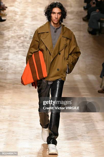 Model walks the runway at the Qasimi show during London Fashion Week Men's January 2018 at 100 Sydney Street on January 6, 2018 in London, England.