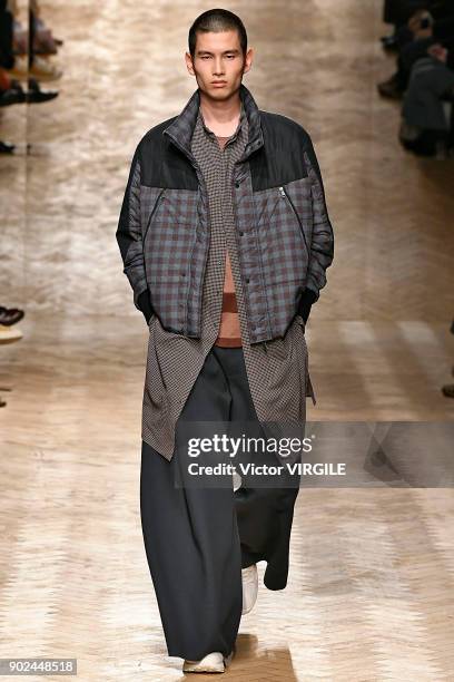 Model walks the runway at the Qasimi show during London Fashion Week Men's January 2018 at 100 Sydney Street on January 6, 2018 in London, England.