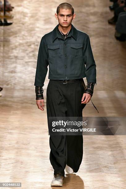 Model walks the runway at the Qasimi show during London Fashion Week Men's January 2018 at 100 Sydney Street on January 6, 2018 in London, England.