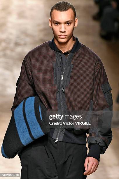 Model walks the runway at the Qasimi show during London Fashion Week Men's January 2018 at 100 Sydney Street on January 6, 2018 in London, England.