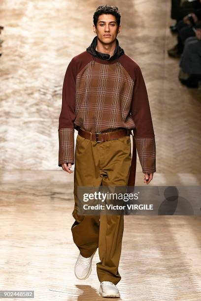 Model walks the runway at the Qasimi show during London Fashion Week Men's January 2018 at 100 Sydney Street on January 6, 2018 in London, England.