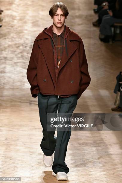 Model walks the runway at the Qasimi show during London Fashion Week Men's January 2018 at 100 Sydney Street on January 6, 2018 in London, England.