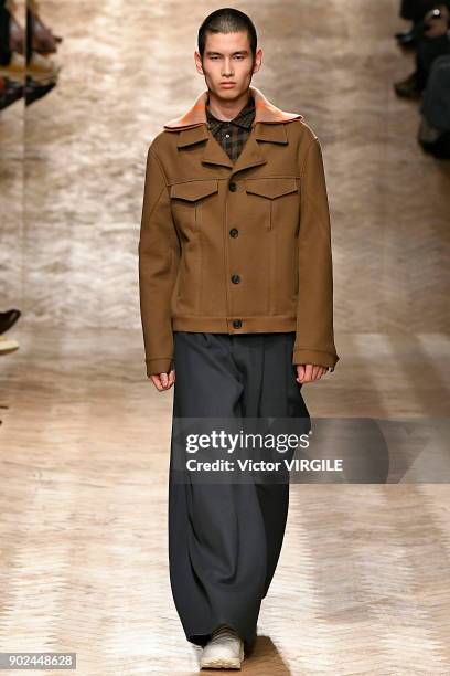 Model walks the runway at the Qasimi show during London Fashion Week Men's January 2018 at 100 Sydney Street on January 6, 2018 in London, England.