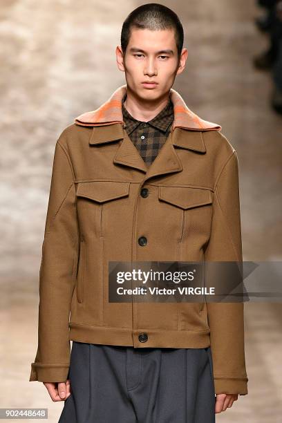 Model walks the runway at the Qasimi show during London Fashion Week Men's January 2018 at 100 Sydney Street on January 6, 2018 in London, England.