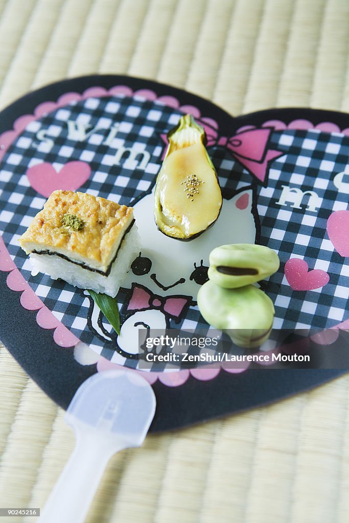 Japanese appetizers, tofu seaweed and rice square, eggplant with tofu sauce and fresh broad beans