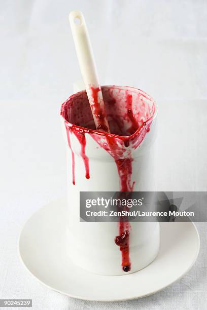 messy pitcher of strawberry syrup - coulis stock pictures, royalty-free photos & images