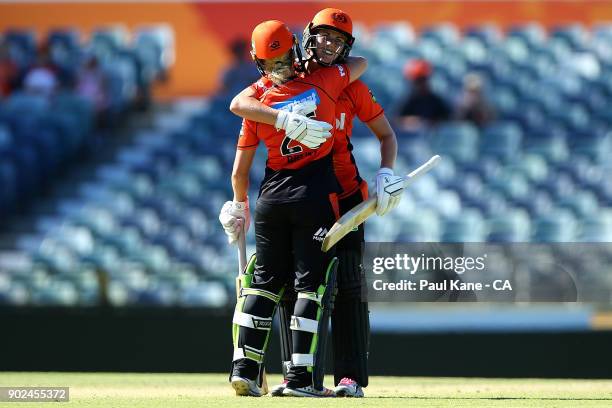 Katherine Brunt and Natalie Sciver of the Scorchers celebrate winning the Women's Big Bash League match between the Perth Scorchers and the Sydney...