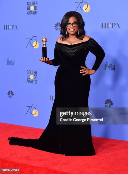 Oprah Winfrey poses with the Cecil B. DeMille Award in the press room during The 75th Annual Golden Globe Awards at The Beverly Hilton Hotel on...