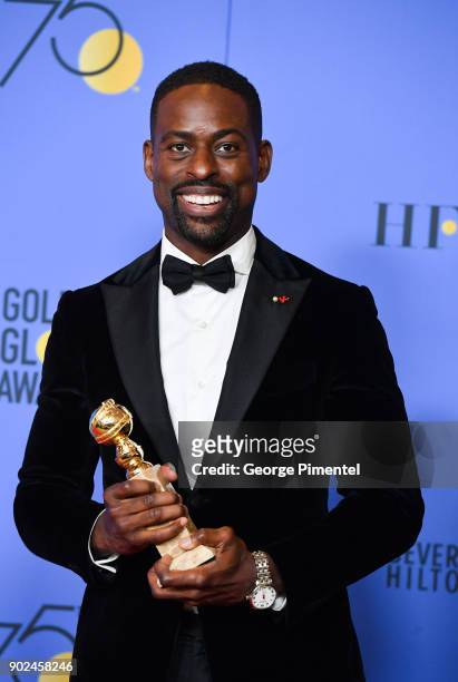Actor Sterling K. Brown holds his award for Best Performance by an Actor In A Television Series Drama in 'This Is Us' in the press room during the...
