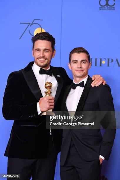 Actor James Franco poses with Best Performance by an Actor in a Motion Picture - Musical or Comedy award for 'The Disaster Artist', with actor Dave...