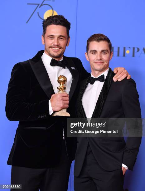 Actor James Franco poses with Best Performance by an Actor in a Motion Picture - Musical or Comedy award for 'The Disaster Artist', with actor Dave...