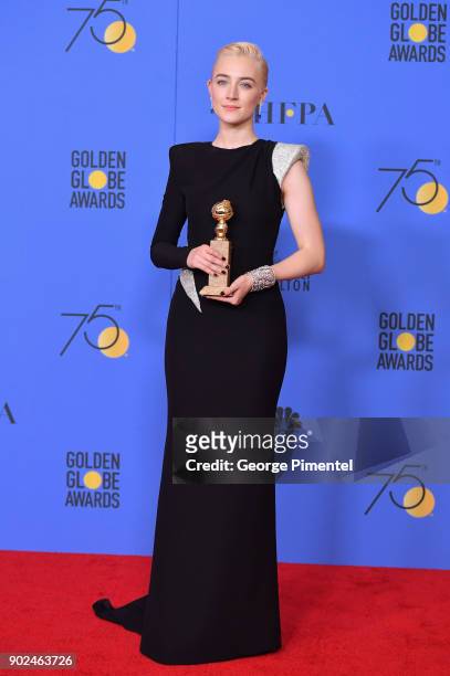 Actress Saoirse Ronan poses with the award for Best Performance by an Actress in a Motion Picture Musical or Comedy in 'Lady Bird' in the press room...
