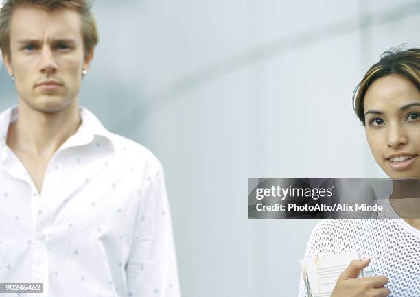 two young people, looking at camera - knitting brow stock pictures, royalty-free photos & images