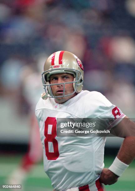 Quarterback Steve Young of the San Francisco 49ers looks on from the field during pregame warm up before a game against the Indianapolis Colts at the...