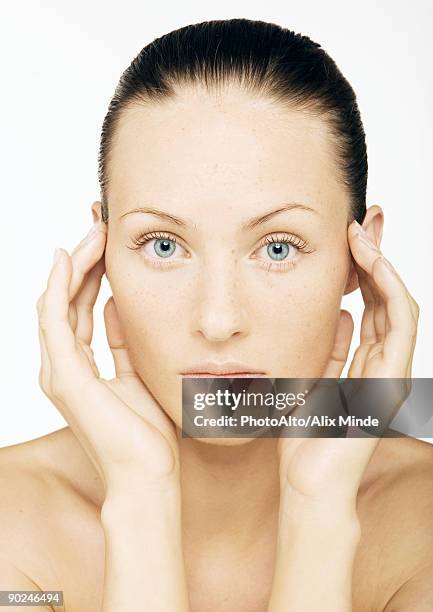 woman's face with hands at side of head, portrait - double facepalm stock pictures, royalty-free photos & images