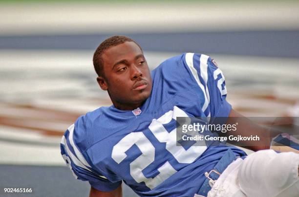 Running back Marshall Faulk of the Indianapolis Colts looks on from the field during pregame warm up before a game against the San Francisco 49ers at...