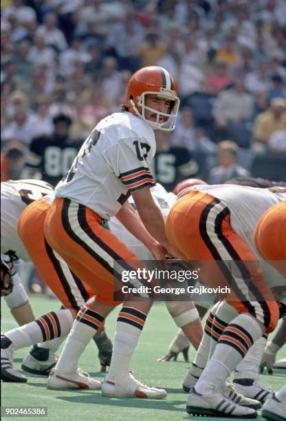 Quarterback Brian Sipe of the Cleveland Browns stands behind center at the line of scrimmage during a game against the Cincinnati Bengals at...