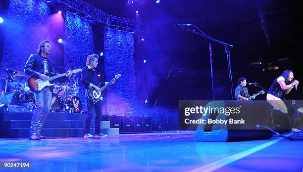 Jonathan Cain, Deen Castronovo, Ross Valory, Neal Schon and Arnel Pineda of Journey perform at the Nassau Veterans Memorial Coliseum on August 31,...